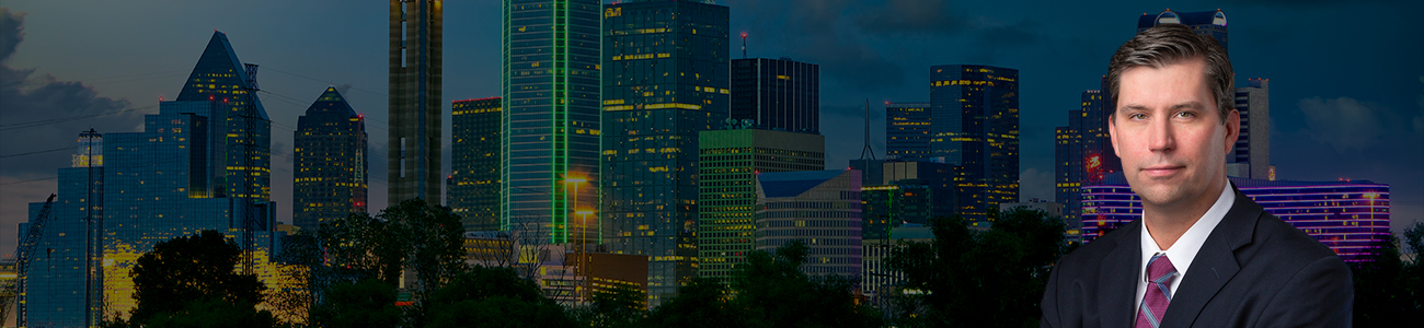 Patrick Kelly with Dallas skyline in the background